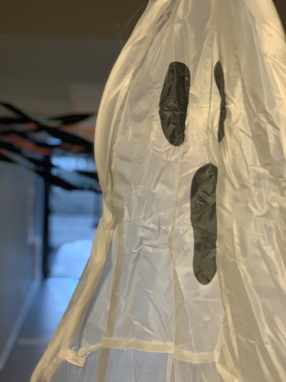 A white paper ghost hanging at the entrance to the terrace